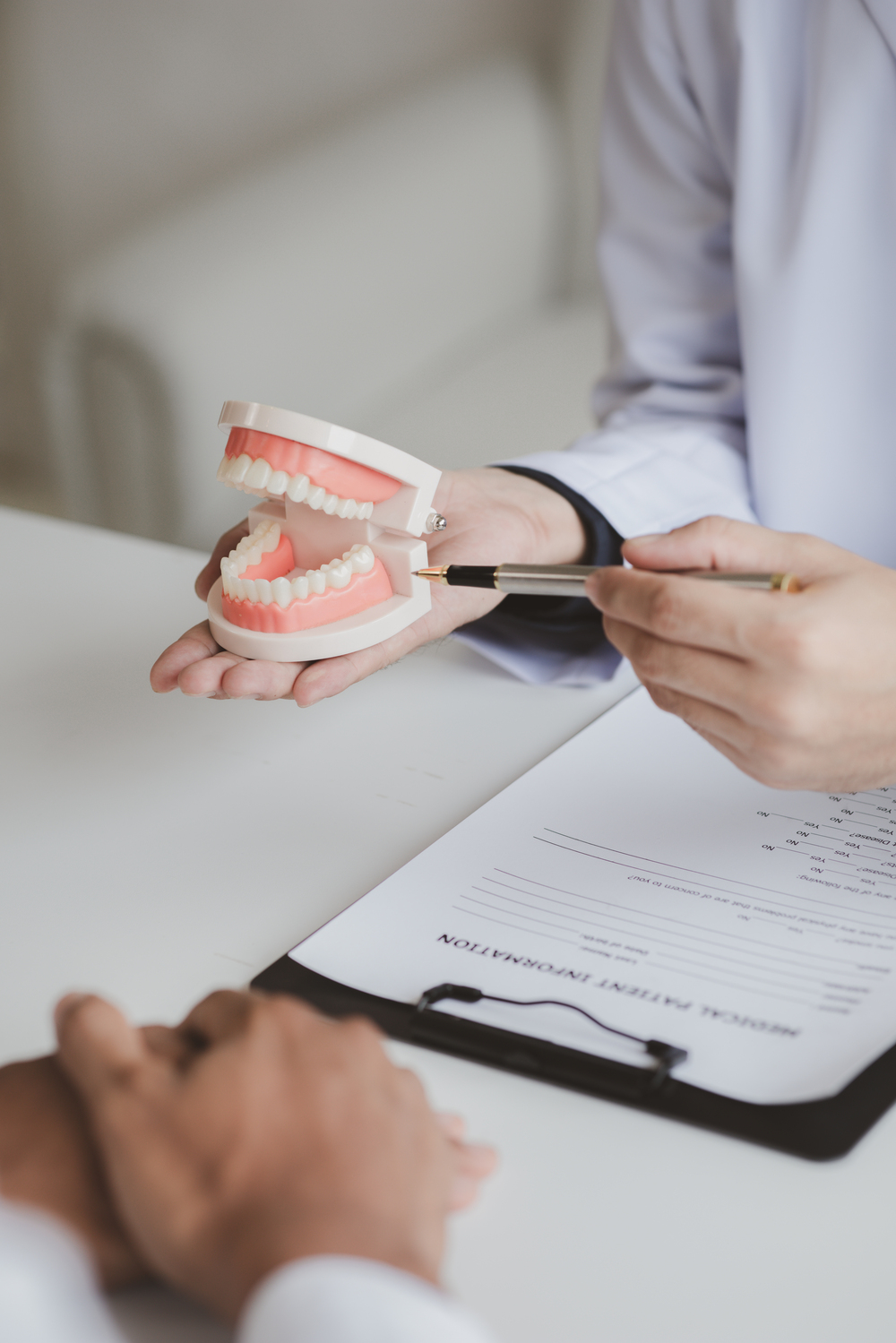 Dentists are providing dental treatment consultations to patients undergoing dental pain treatment, root canal treatment, cavities, hygiene and healthy teeth. Dentistry concept.